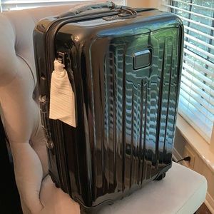 Tumi 4 wheel international carry on (NWT)